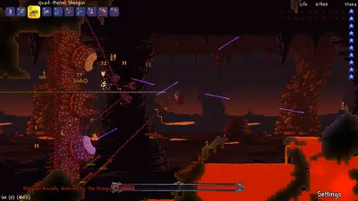 The Wall of Flesh boss advancing through the lava-filled Underworld biome